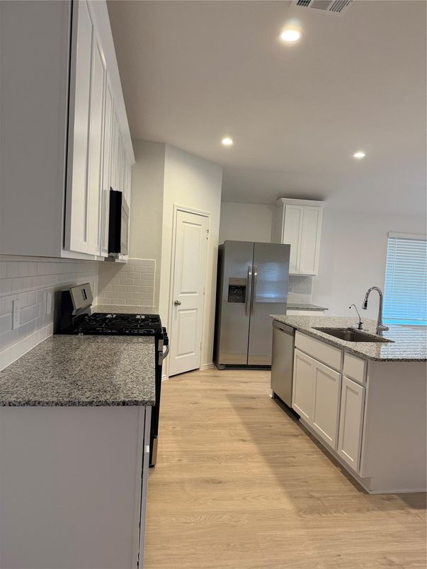 Interior, Kitchen, Recessed Lighting, Stainless Steel Appliances, Wood Texture Flooring