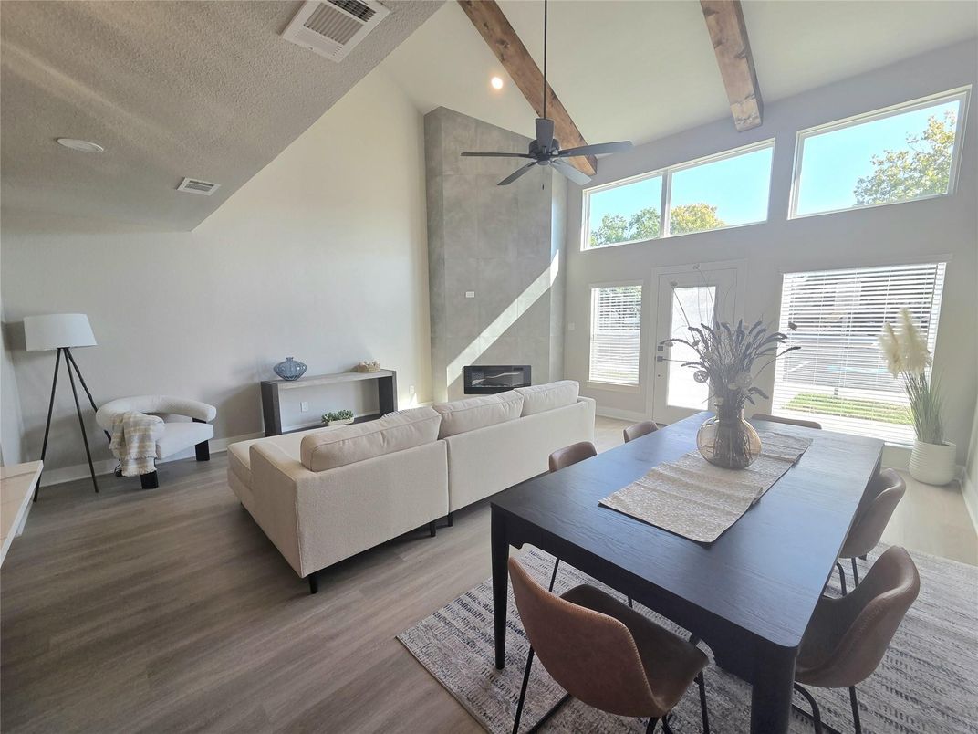 Dining room, Fireplace, Interior, Living room, Recessed Lighting, Wooden Beams, Wood Texture Flooring