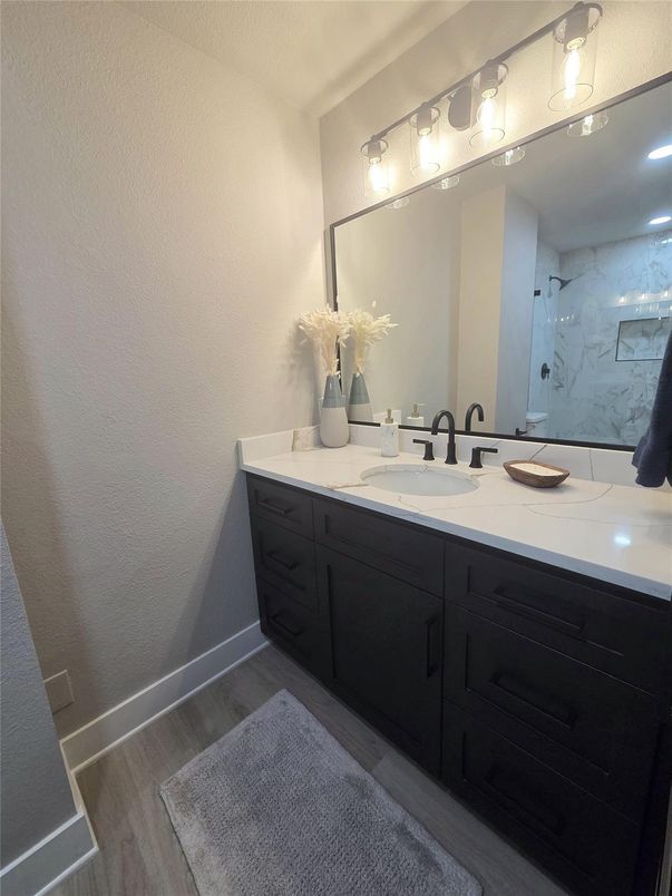 Bathroom, Dual Sink Vanities, Interior, Marble Walls, Wood Texture Flooring