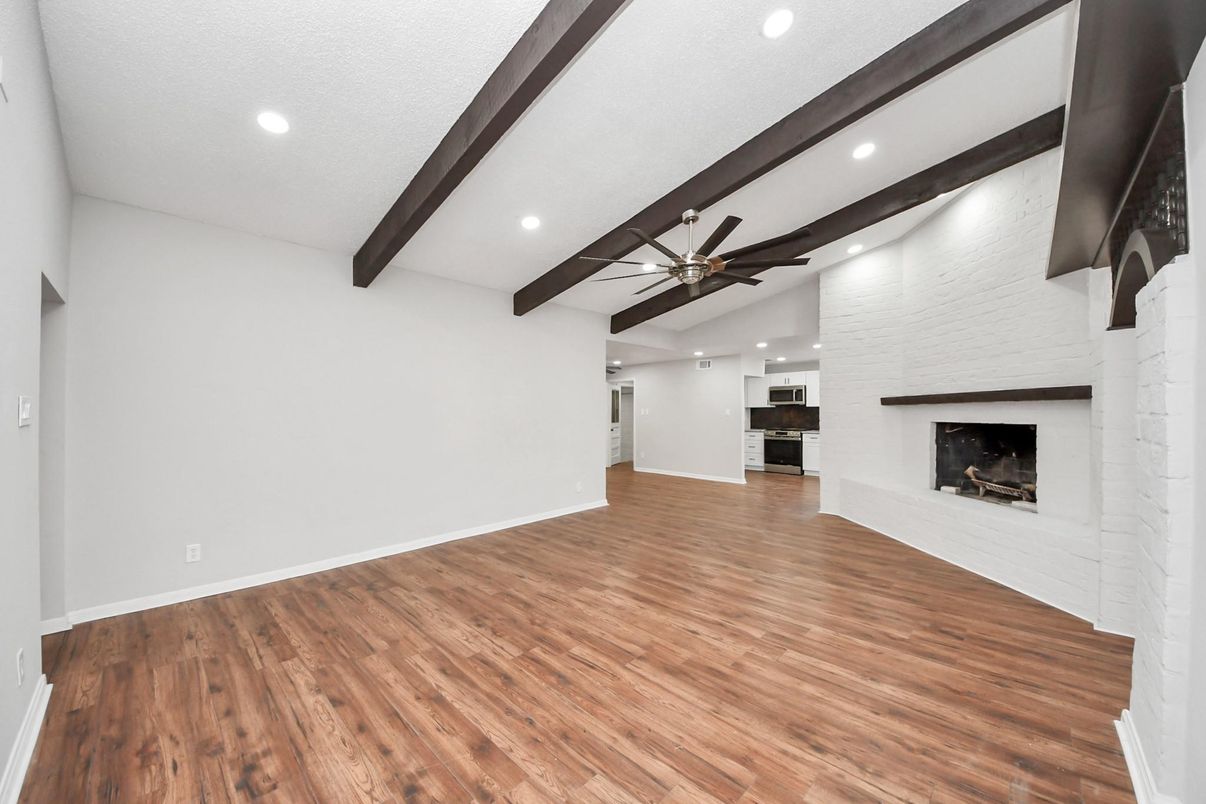 Empty room, Fireplace, Interior, Recessed Lighting, Wooden Beams, Wood Texture Flooring