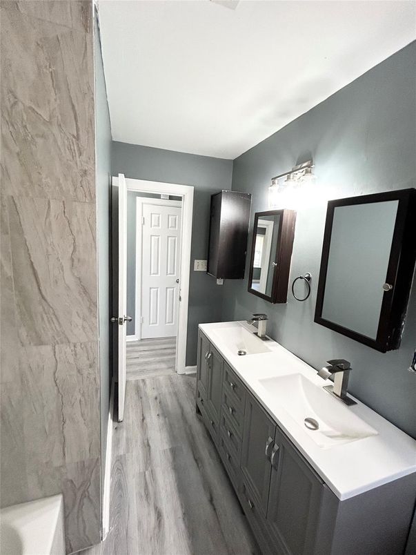 Bathroom, Dual Sink Vanities, Interior, Marble Walls, Wood Texture Flooring