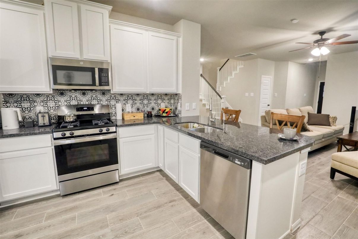 Dining room, Interior, Kitchen, Recessed Lighting, Stainless Steel Appliances, Wood Texture Flooring