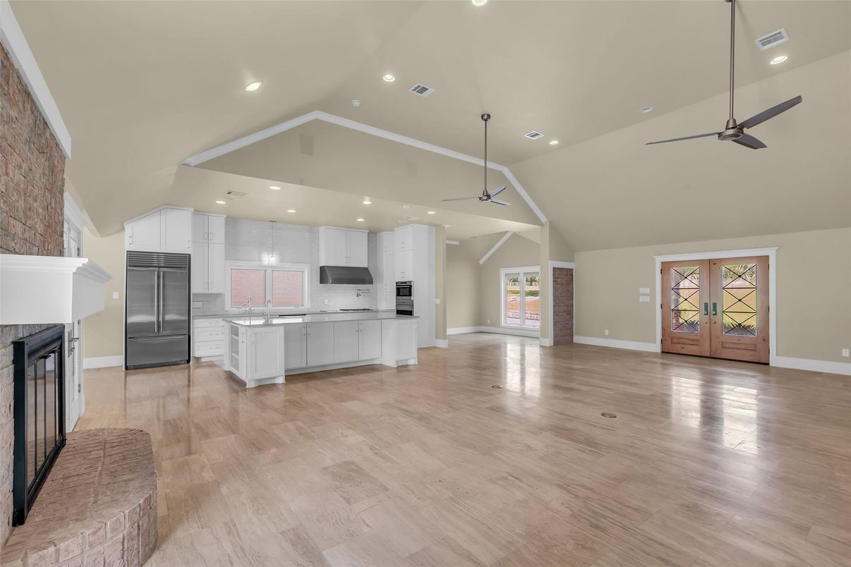Fireplace, Interior, Kitchen, Pendant Lights, Recessed Lighting, Stainless Steel Appliances, Wood Texture Flooring