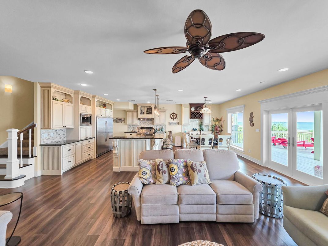 Dining room, Interior, Kitchen, Living room, Pendant Lights, Recessed Lighting, Stainless Steel Appliances, Water, Wood Texture Flooring