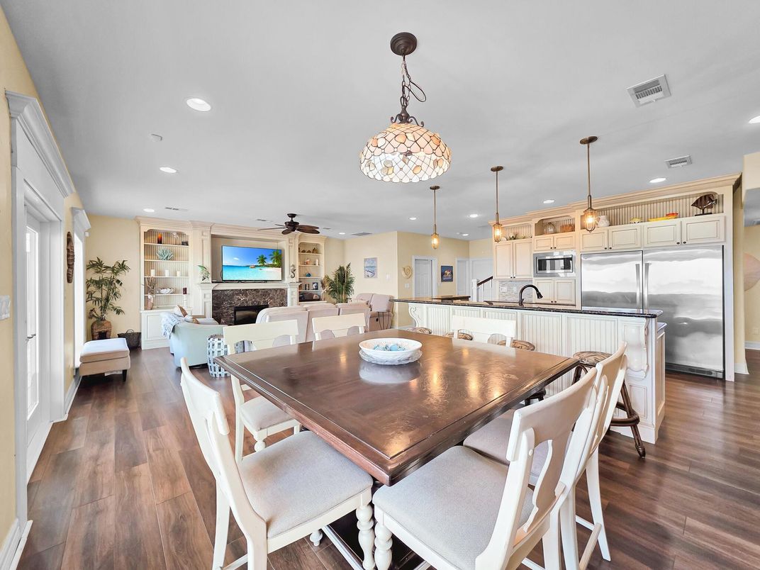 Dining room, Fireplace, Interior, Kitchen, Living room, Pendant Lights, Recessed Lighting, Stainless Steel Appliances, Wood Texture Flooring