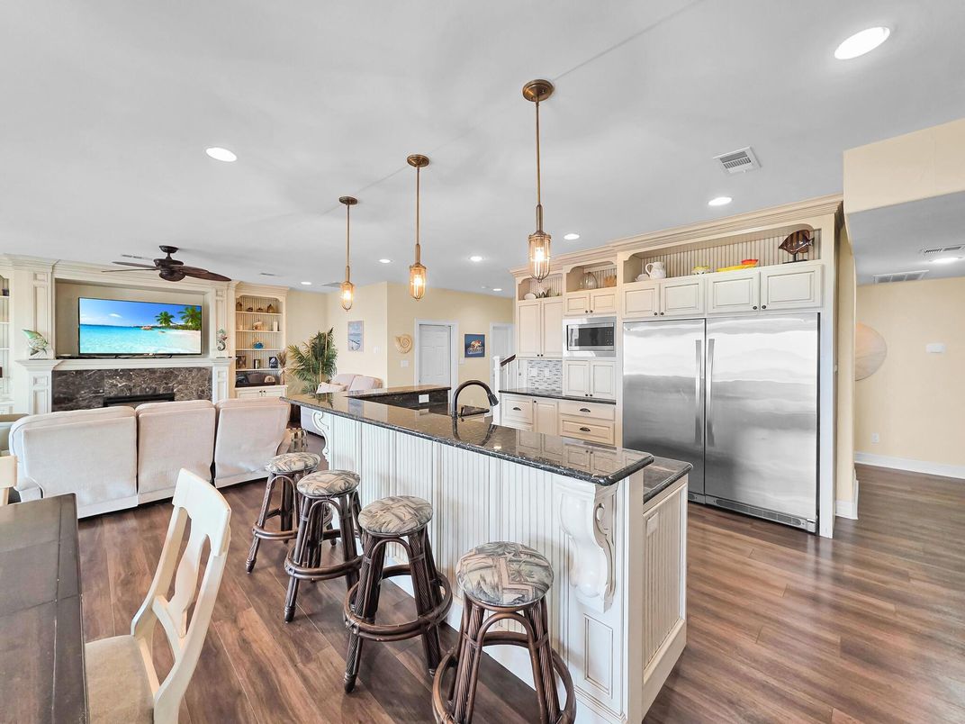 Fireplace, Interior, Kitchen, Pendant Lights, Recessed Lighting, Stainless Steel Appliances, Wood Texture Flooring