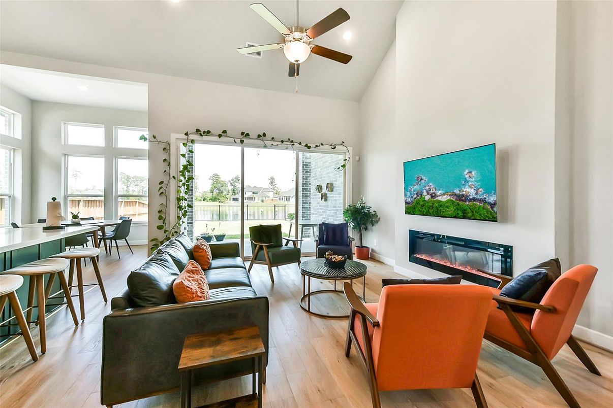 Dining room, Fireplace, Interior, Living room, Recessed Lighting, Wood Texture Flooring