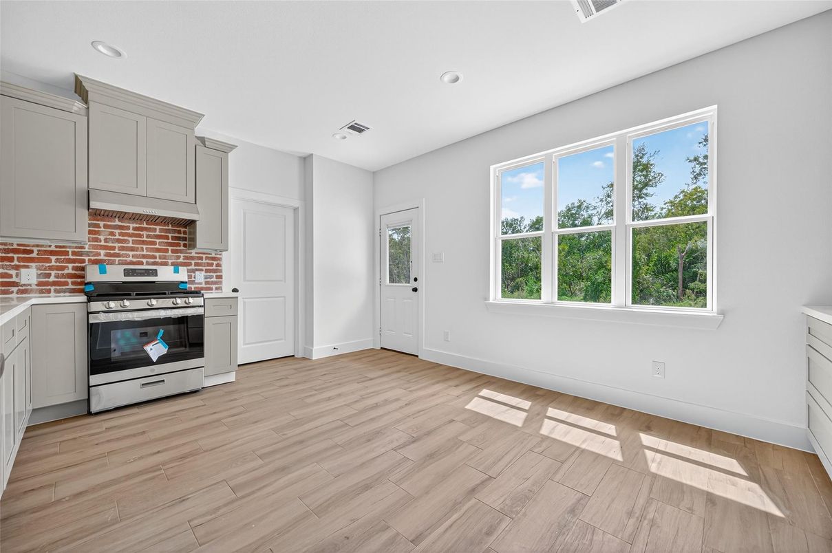 Interior, Kitchen, Recessed Lighting, Stainless Steel Appliances, Stone Walls, Wood Texture Flooring