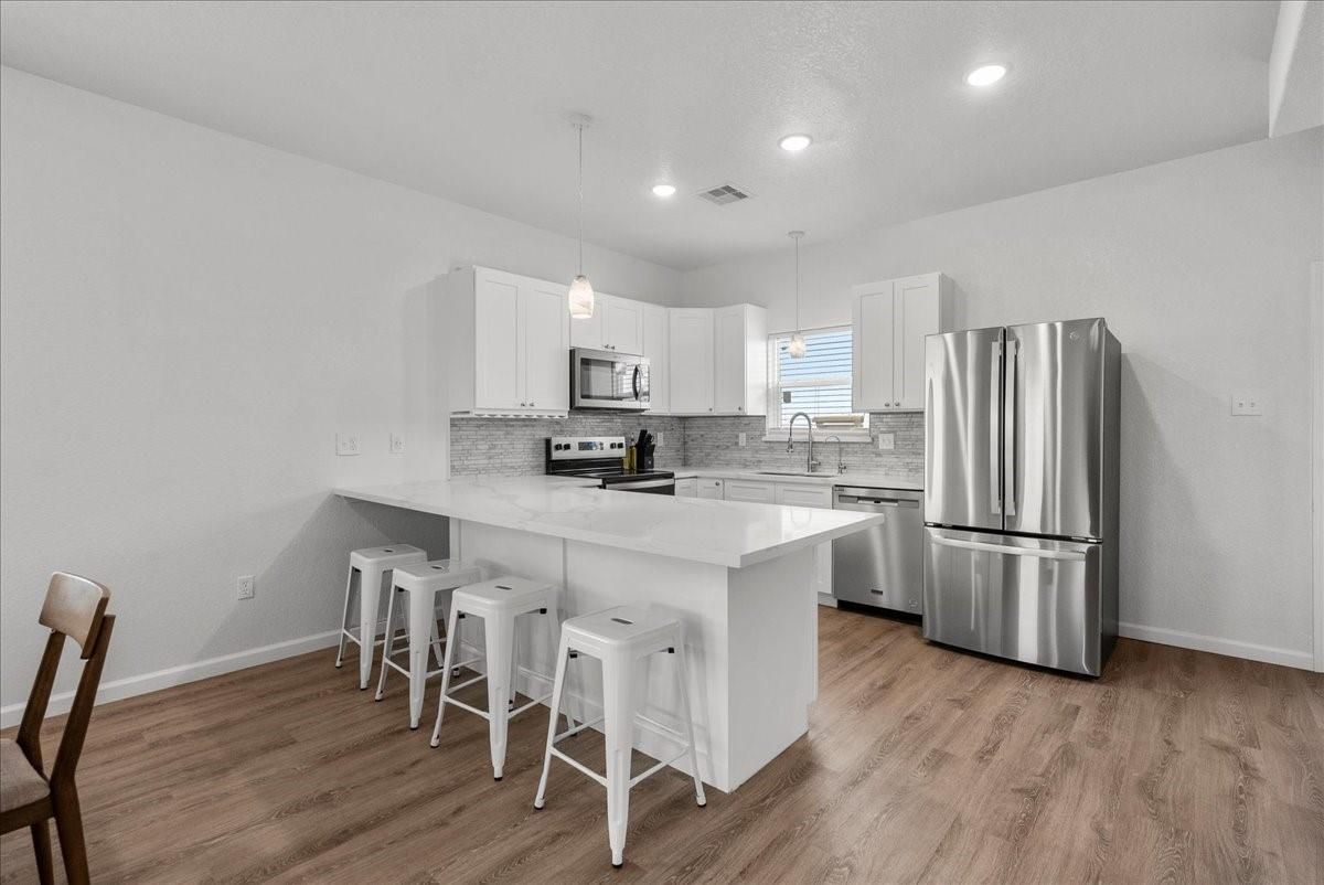 Interior, Kitchen, Pendant Lights, Recessed Lighting, Stainless Steel Appliances, Wood Texture Flooring