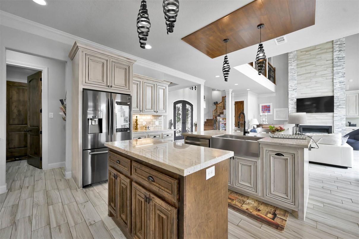 Fireplace, Interior, Kitchen, Pendant Lights, Recessed Lighting, Stainless Steel Appliances, Wood Texture Flooring