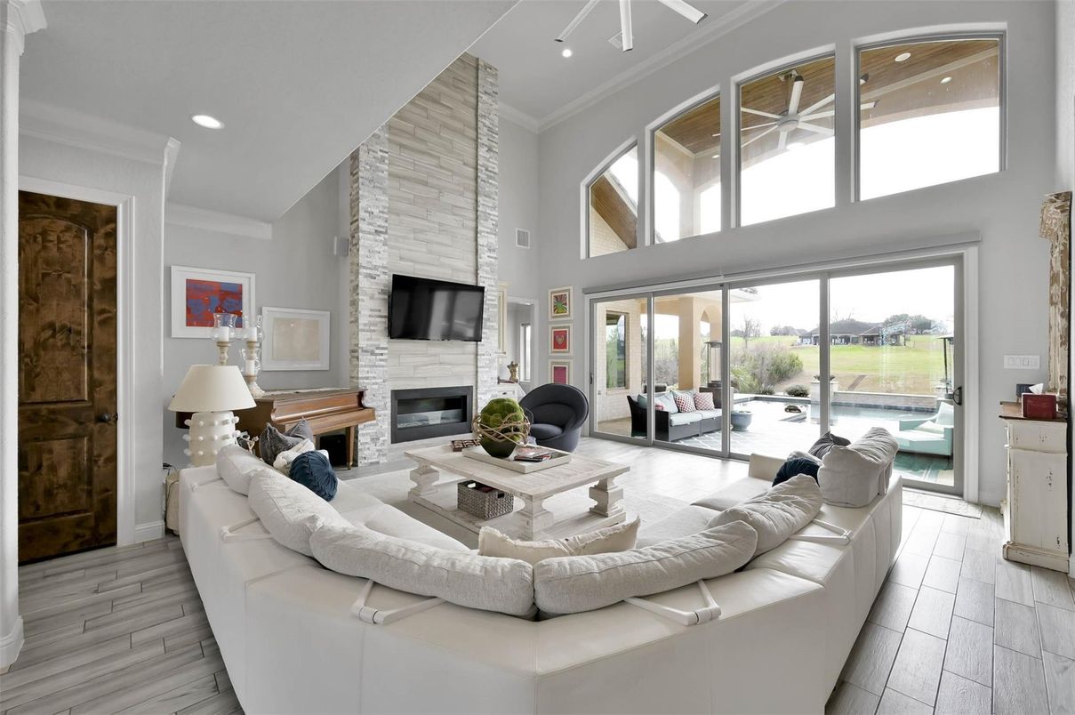 Fireplace, Interior, Living room, Recessed Lighting, Stone Walls, Wood Texture Flooring