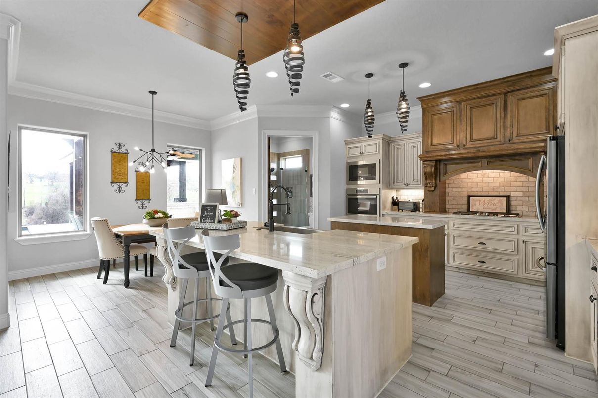 Dining room, Interior, Kitchen, Pendant Lights, Recessed Lighting, Stainless Steel Appliances, Wooden Ceilings, Wood Texture Flooring