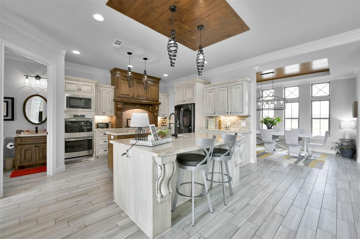 Dining room, Interior, Kitchen, Pendant Lights, Recessed Lighting, Stainless Steel Appliances, Wooden Ceilings, Wood Texture Flooring