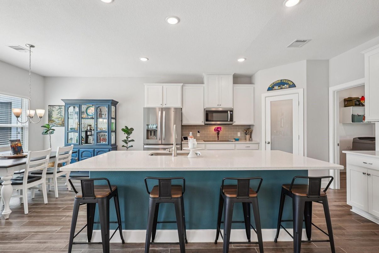 Chandelier, Dining room, Interior, Kitchen, Pendant Lights, Recessed Lighting, Stainless Steel Appliances, Wood Texture Flooring