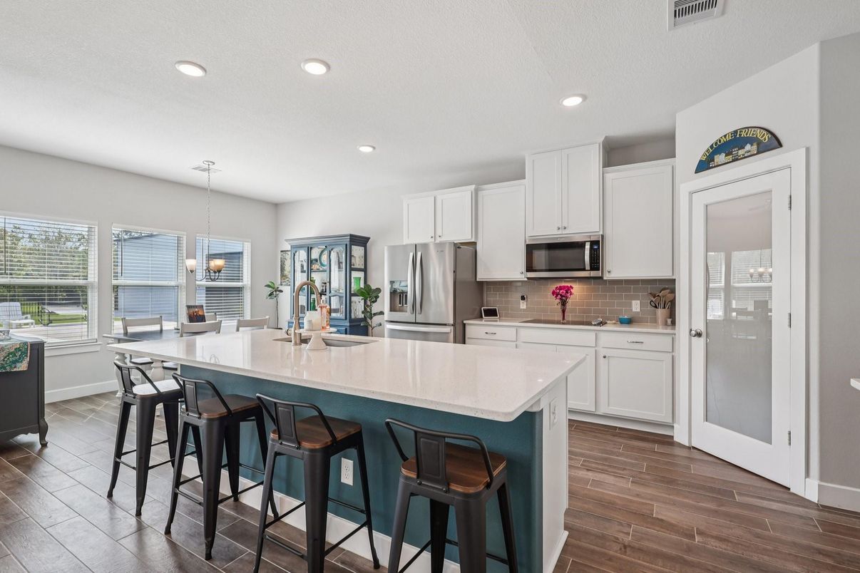 Dining room, Interior, Kitchen, Pendant Lights, Recessed Lighting, Stainless Steel Appliances, Wood Texture Flooring