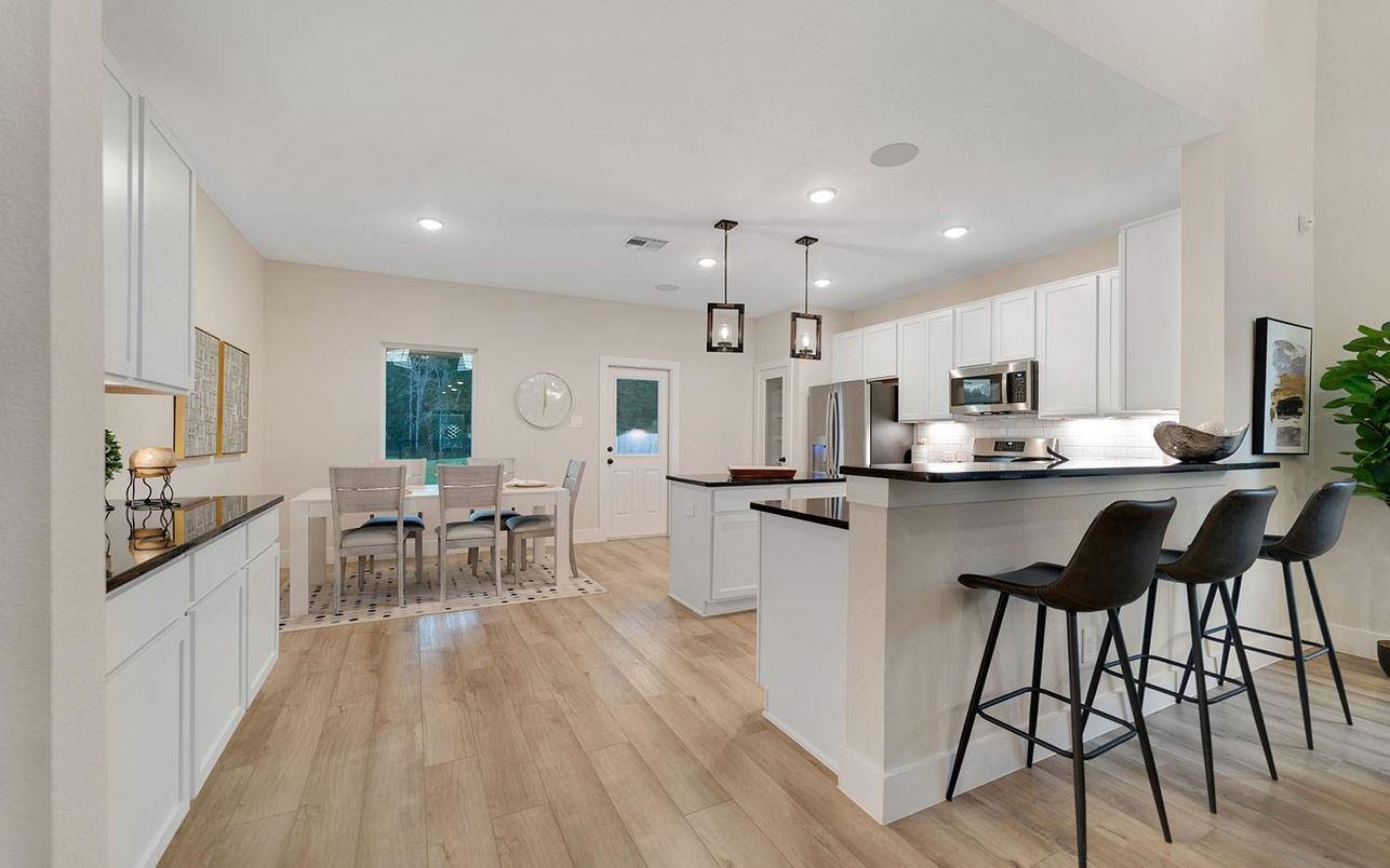 Dining room, Interior, Kitchen, Pendant Lights, Recessed Lighting, Stainless Steel Appliances, Wood Texture Flooring