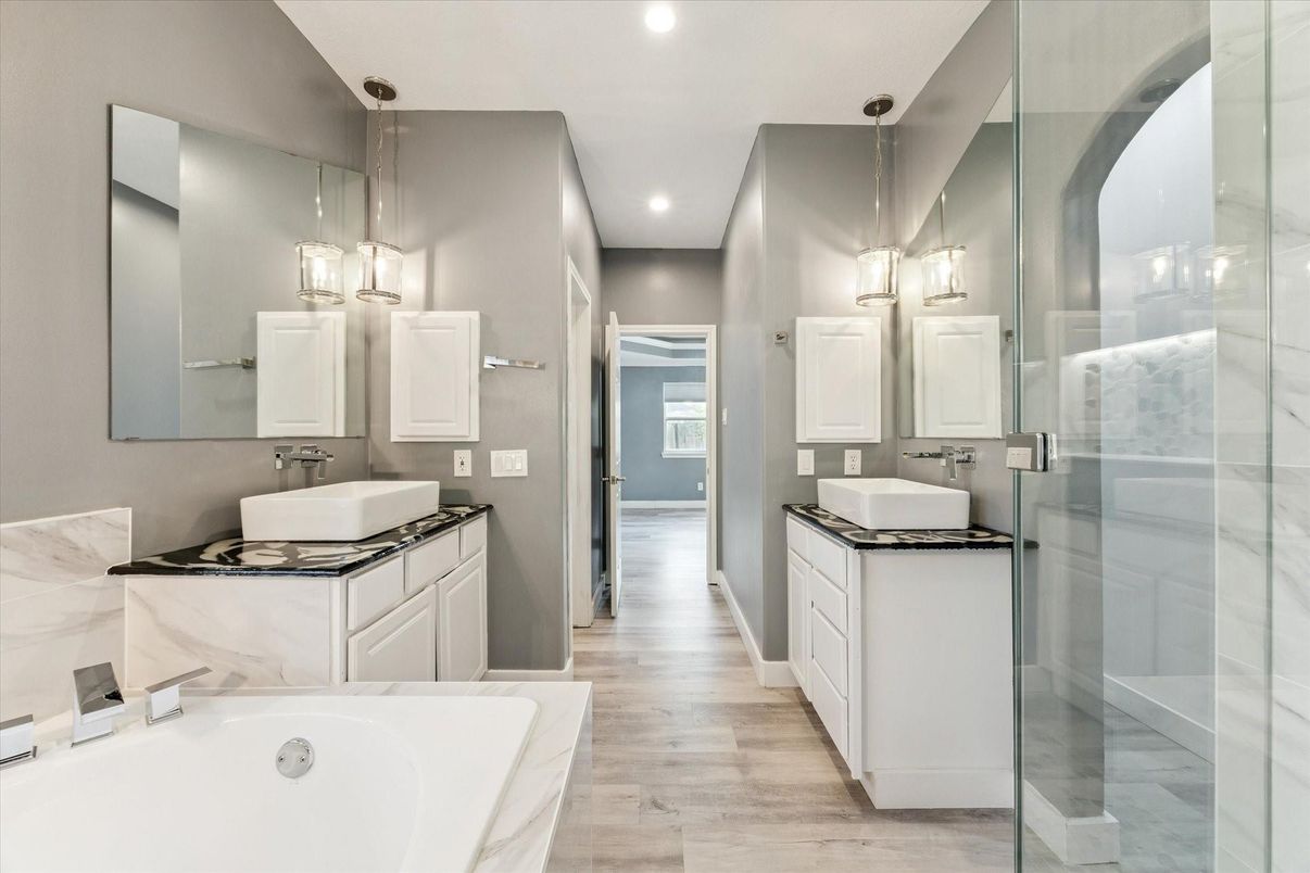 Bathroom, Dual Sink Vanities, Glass Shower, Interior, Pendant Lights, Recessed Lighting, Wood Texture Flooring