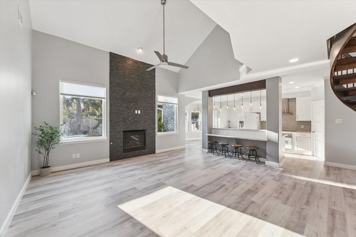 Empty room, Fireplace, Interior, Kitchen, Pendant Lights, Recessed Lighting, Wood Texture Flooring