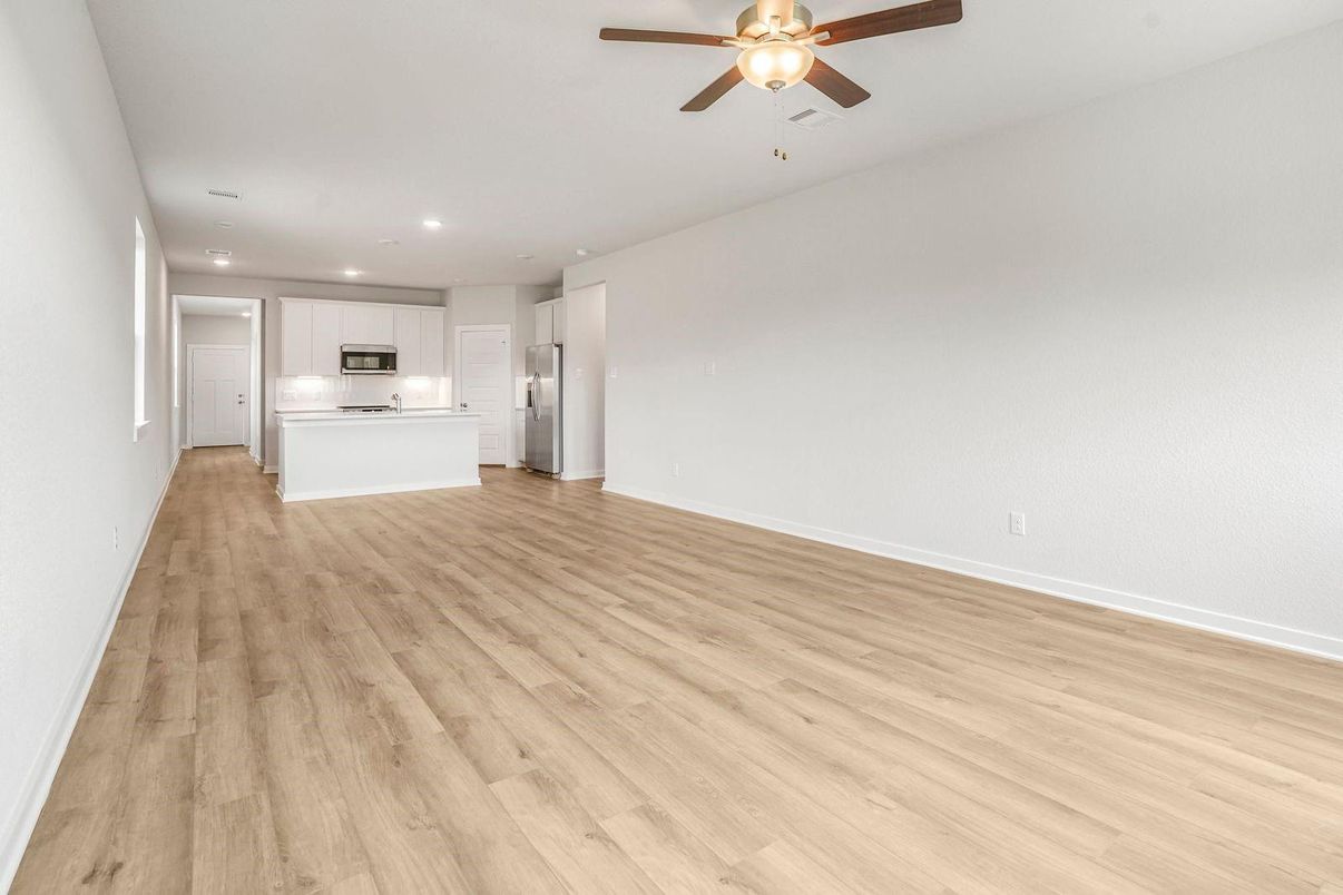 Empty room, Interior, Kitchen, Recessed Lighting, Stainless Steel Appliances, Wood Texture Flooring