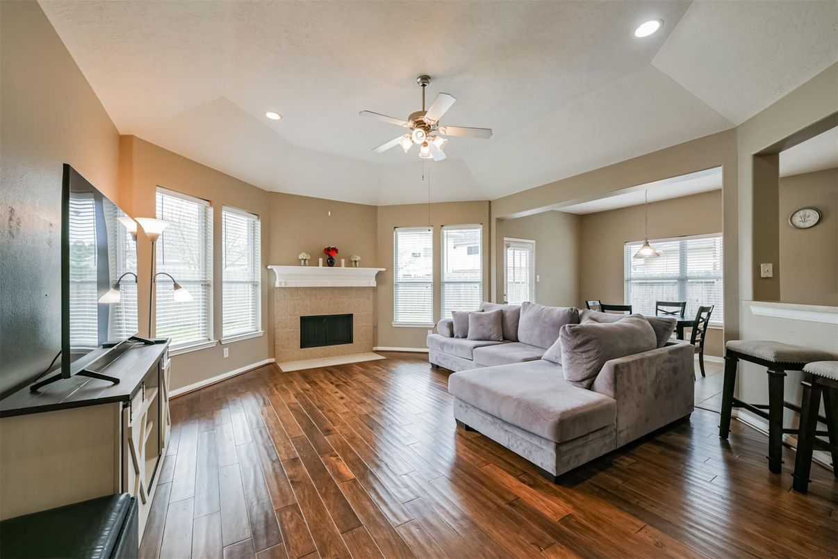 Dining room, Fireplace, Interior, Living room, Pendant Lights, Recessed Lighting, Wood Texture Flooring