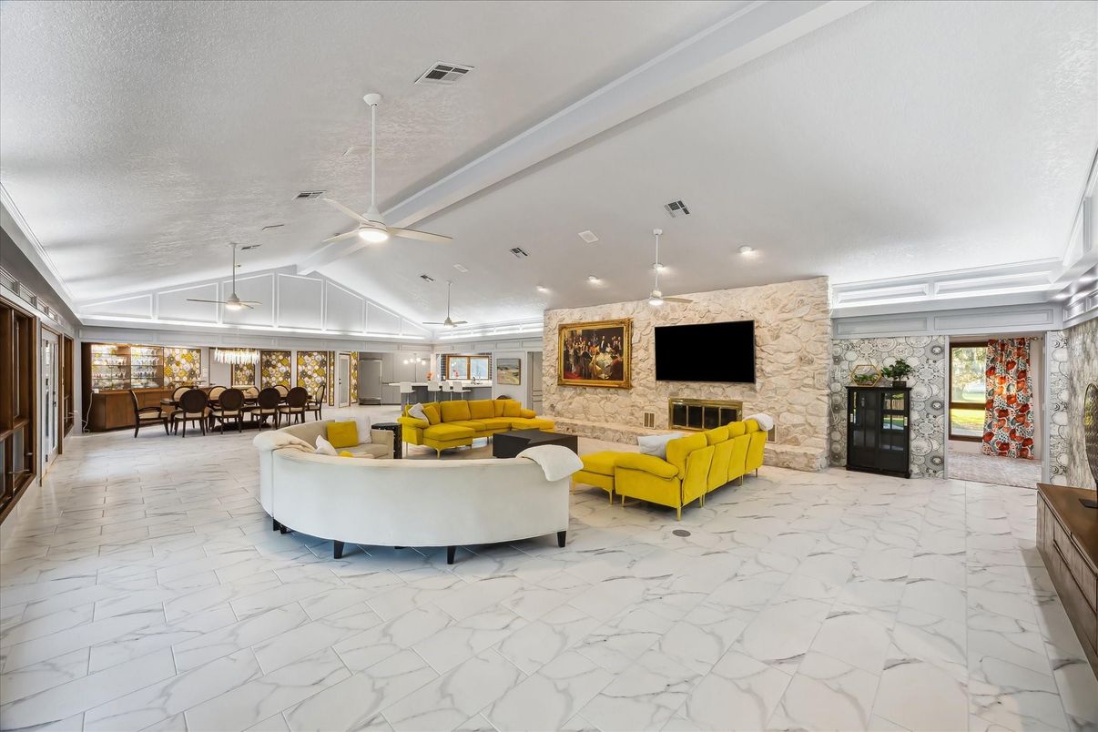 Dining room, Fireplace, Interior, Living room, Marble, Pendant Lights, Recessed Lighting, Stone Walls
