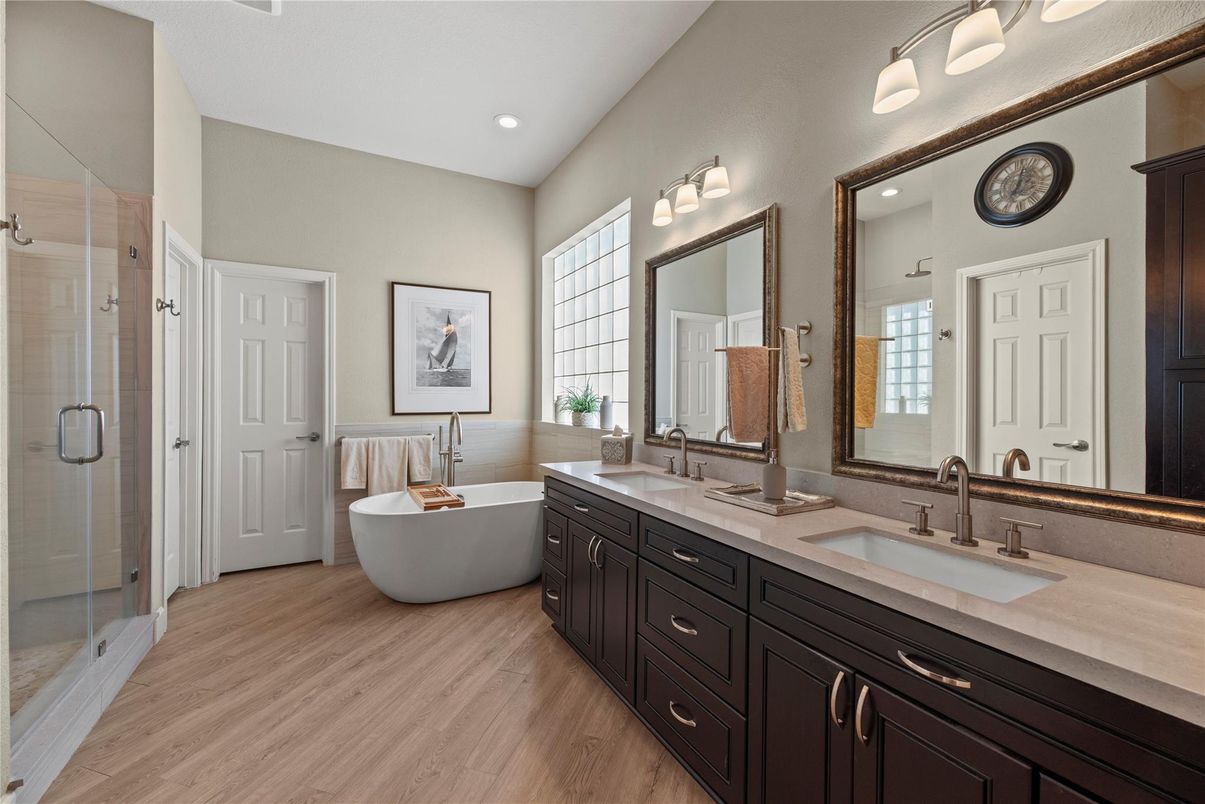 Bathroom, Dual Sink Vanities, Free Standing Baths, Glass Shower, Interior, Recessed Lighting, Wood Texture Flooring