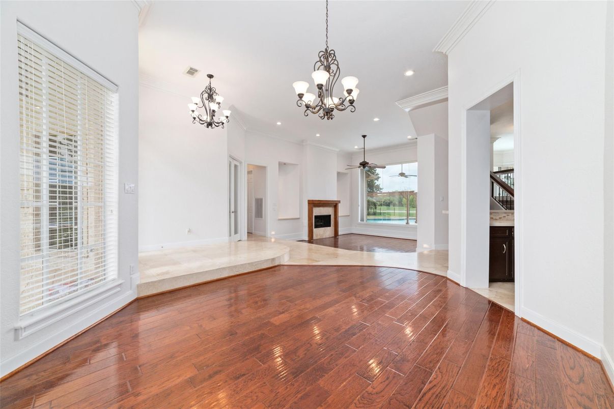 Chandelier, Empty room, Fireplace, Interior, Recessed Lighting, Wood Texture Flooring