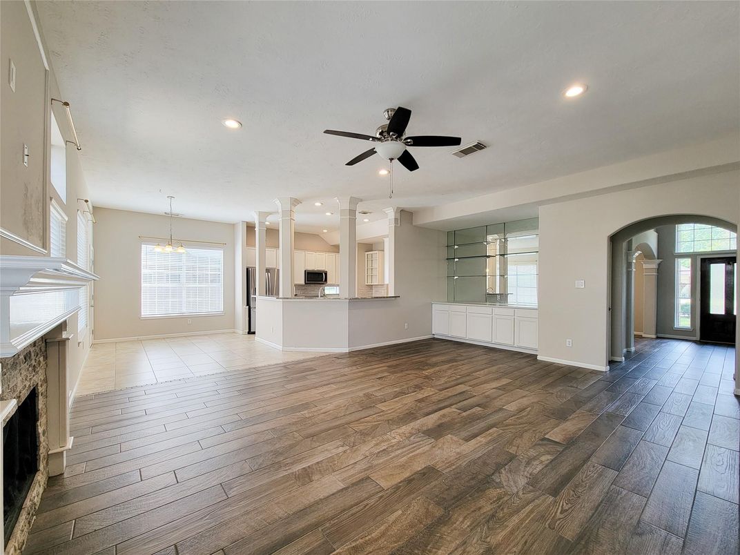 Chandelier, Empty room, Fireplace, Interior, Kitchen, Pendant Lights, Recessed Lighting, Wood Texture Flooring