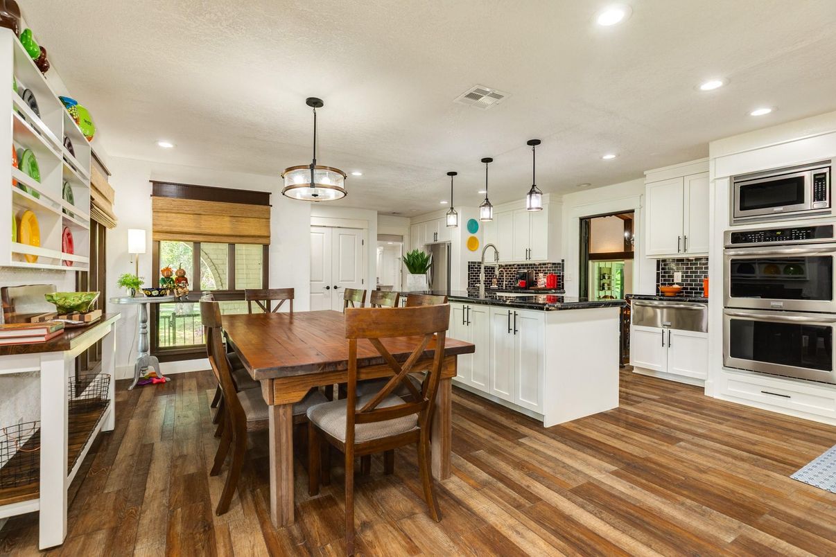 Dining room, Interior, Kitchen, Pendant Lights, Recessed Lighting, Stainless Steel Appliances, Wood Texture Flooring
