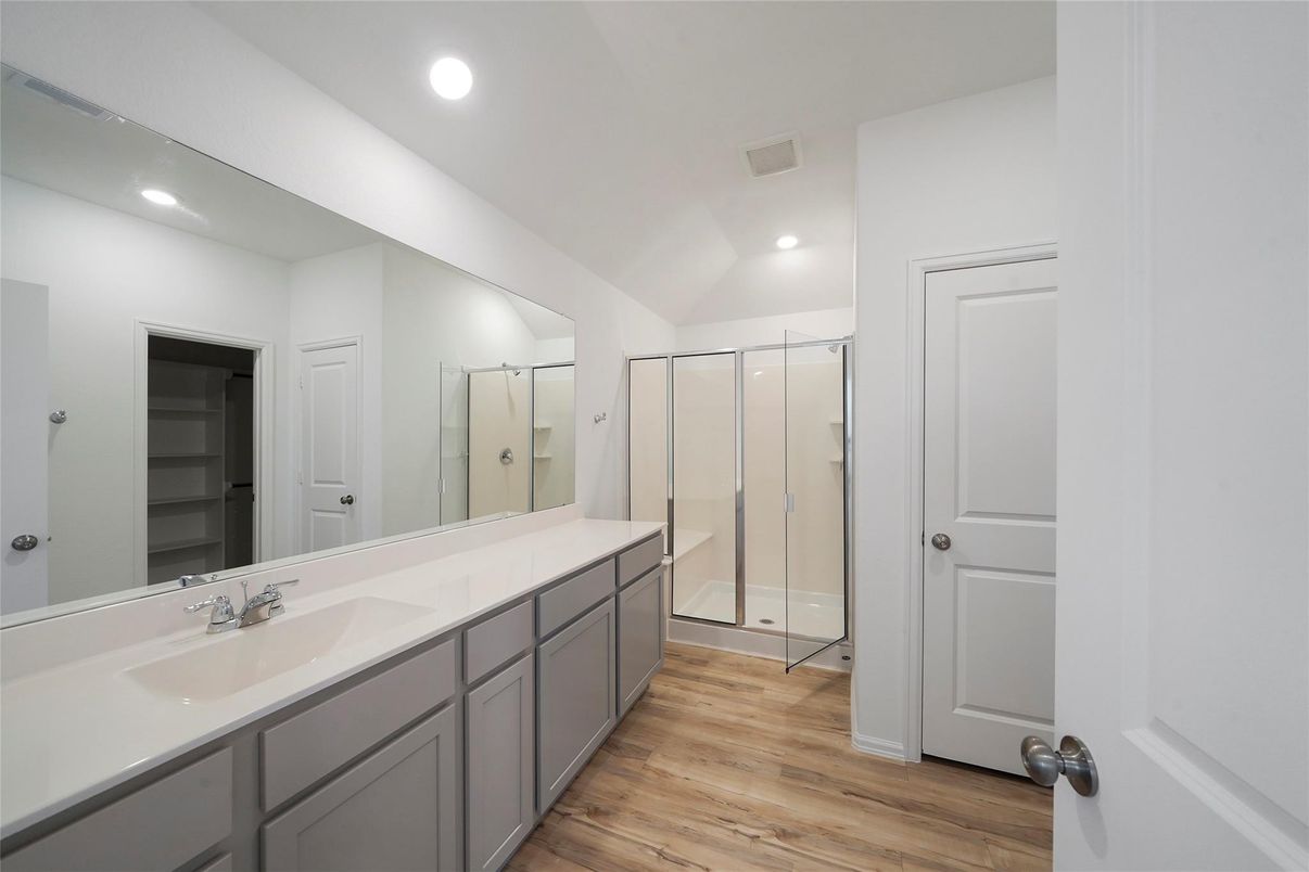 Bathroom, Dual Sink Vanities, Glass Shower, Interior, Recessed Lighting, Wood Texture Flooring
