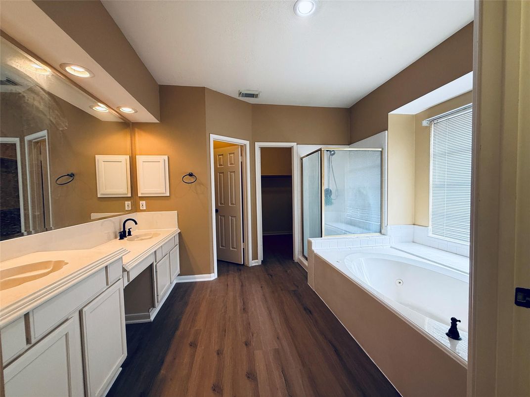 Bathroom, Dual Sink Vanities, Glass Shower, Interior, Recessed Lighting, Wood Texture Flooring
