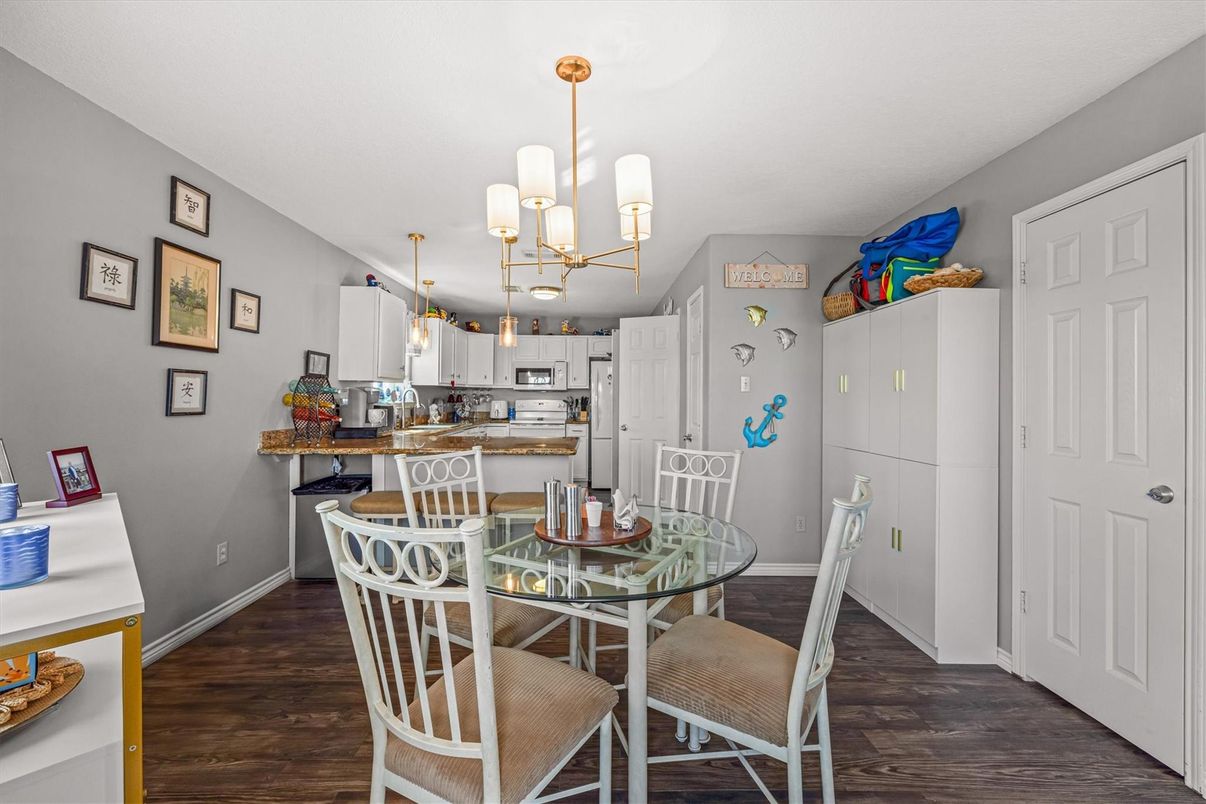 Chandelier, Dining room, Interior, Kitchen, Pendant Lights, Stainless Steel Appliances, Wood Texture Flooring