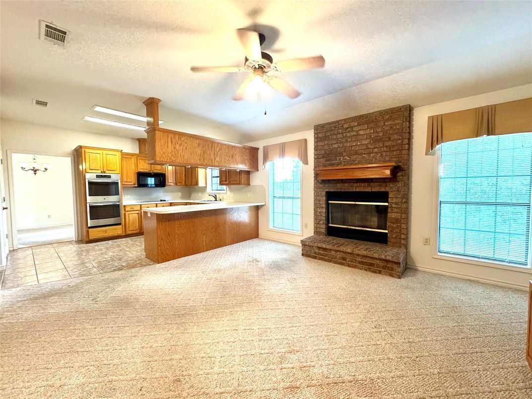 Empty room, Fireplace, Interior, Kitchen, Stainless Steel Appliances, Stone Walls