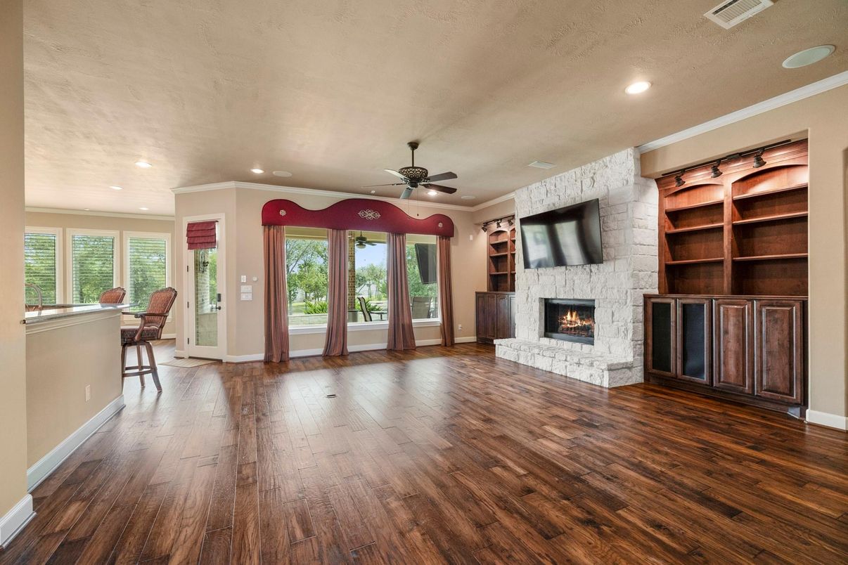 Empty room, Fireplace, Interior, Recessed Lighting, Stone Walls, Wood Texture Flooring