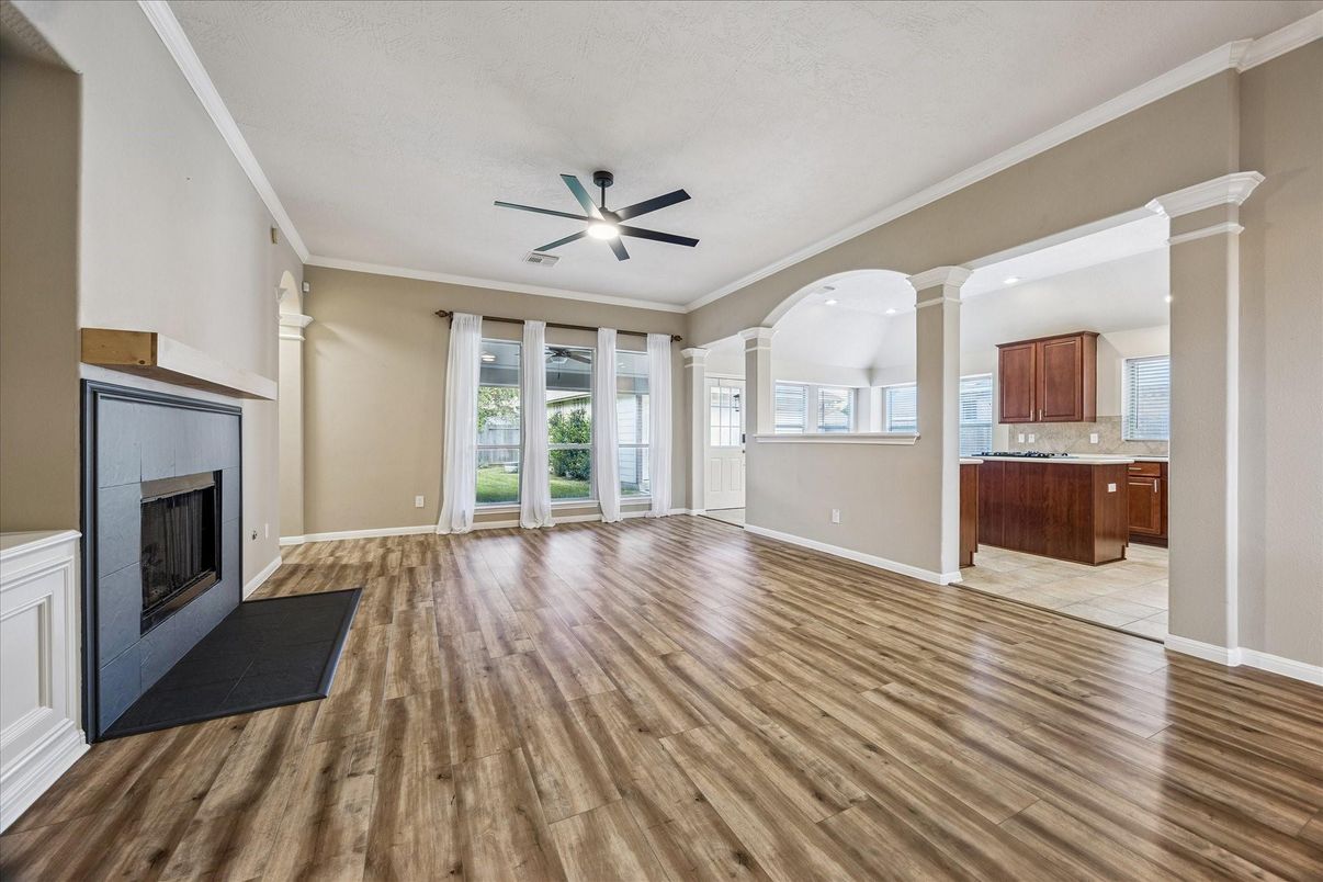 Empty room, Fireplace, Interior, Kitchen, Recessed Lighting, Wood Texture Flooring