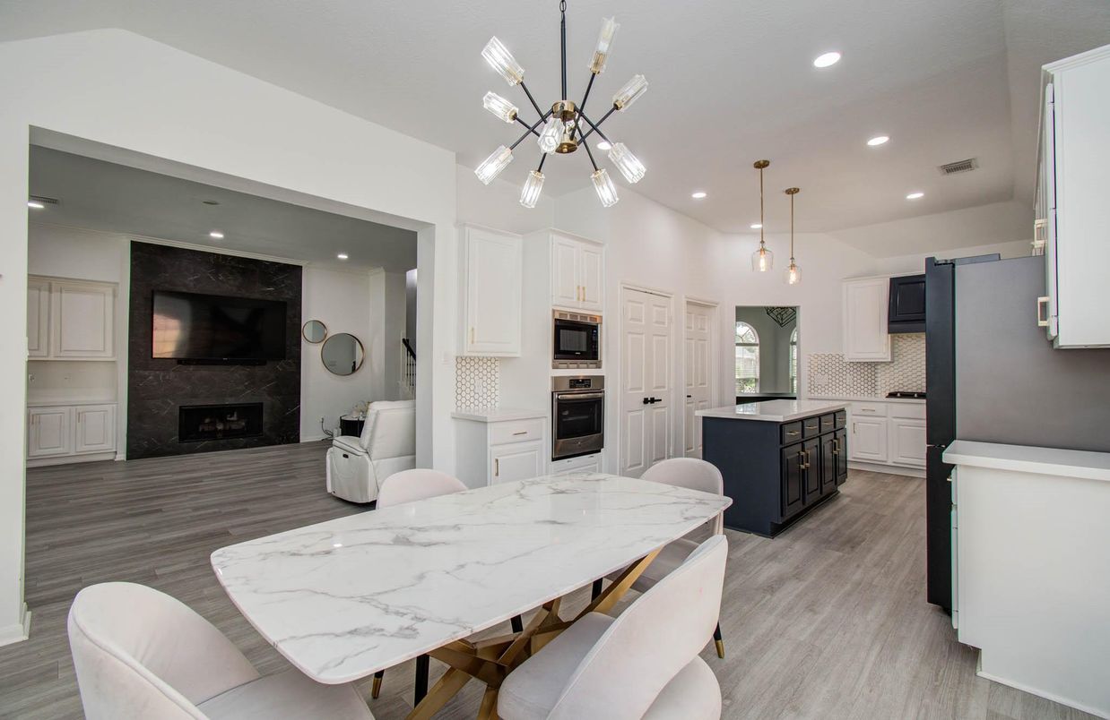 Dining room, Fireplace, Interior, Kitchen, Pendant Lights, Recessed Lighting, Stainless Steel Appliances, Wood Texture Flooring