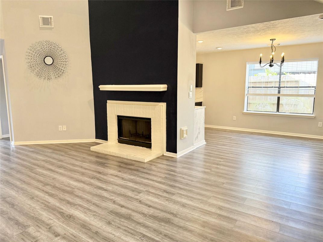 Empty room, Fireplace, Interior, Pendant Lights, Recessed Lighting, Wood Texture Flooring
