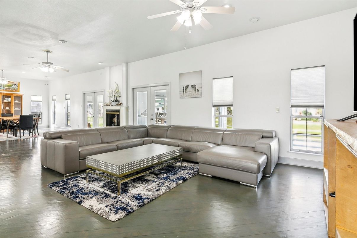Dining room, Fireplace, Interior, Living room, Recessed Lighting, Wood Texture Flooring