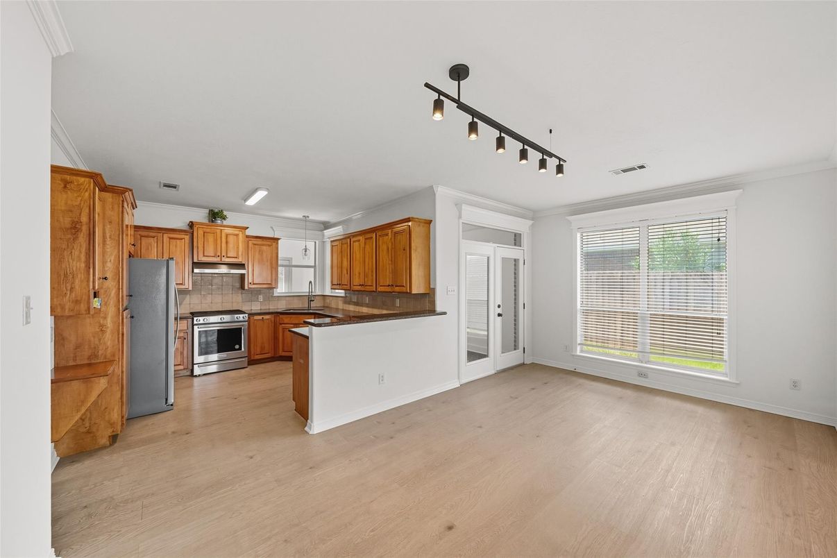 Empty room, Interior, Kitchen, Stainless Steel Appliances, Wood Texture Flooring