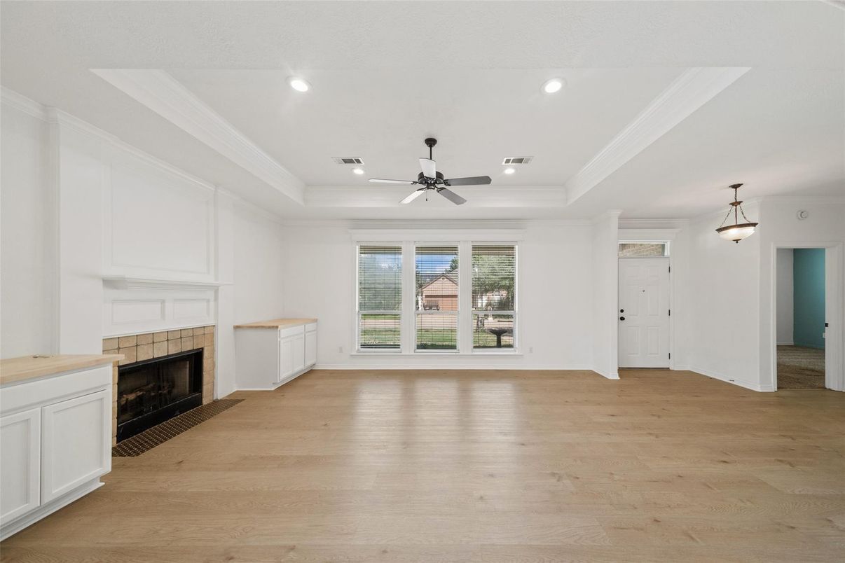 Empty room, Fireplace, Interior, Pendant Lights, Recessed Lighting, Wood Texture Flooring