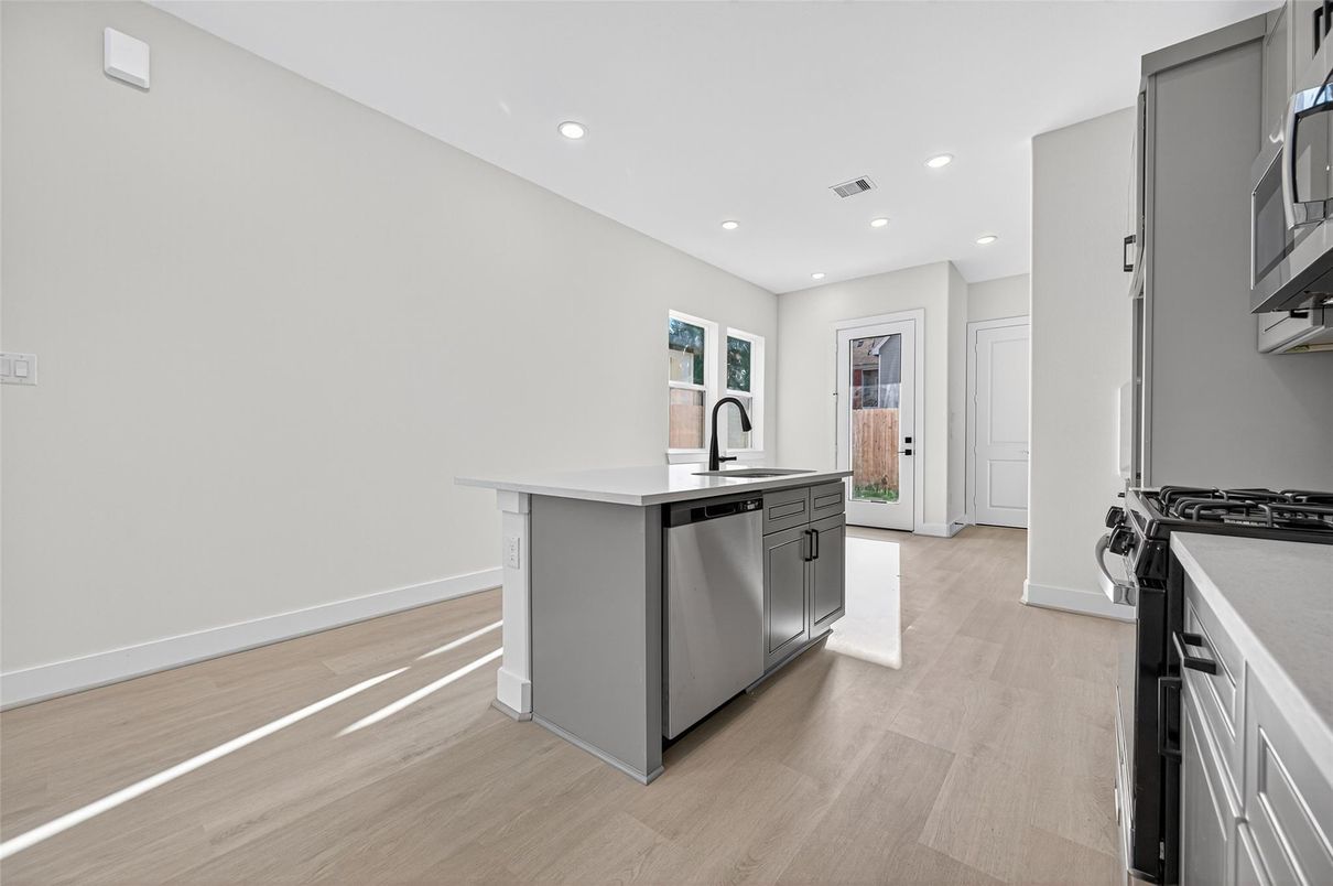 Interior, Kitchen, Recessed Lighting, Stainless Steel Appliances, Wood Texture Flooring