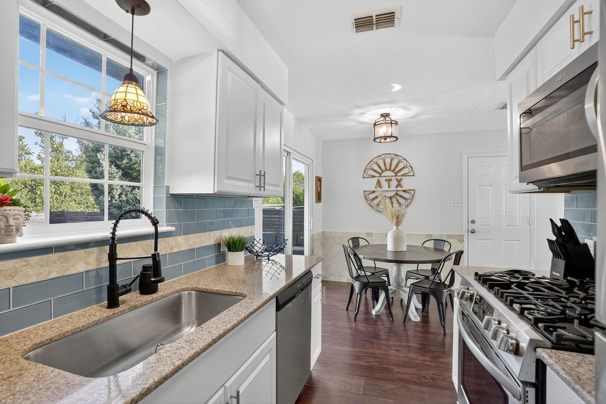 Dining room, Interior, Kitchen, Pendant Lights, Recessed Lighting, Stainless Steel Appliances, Wood Texture Flooring