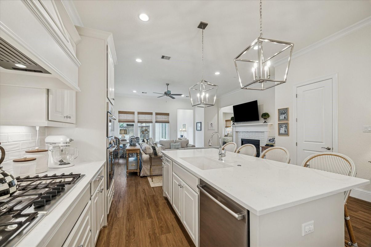 Fireplace, Interior, Kitchen, Living room, Pendant Lights, Recessed Lighting, Stainless Steel Appliances, Wood Texture Flooring
