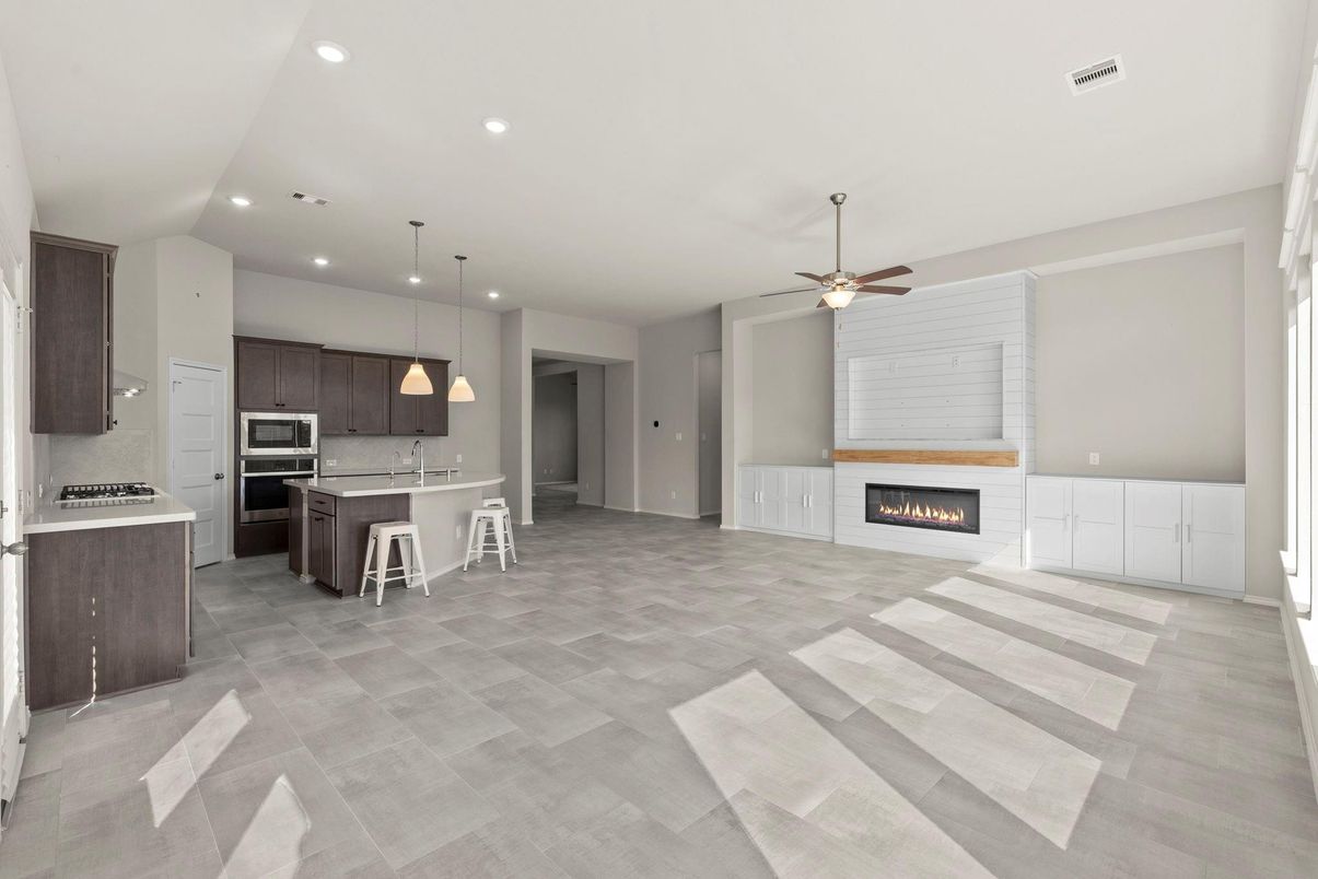 Empty room, Fireplace, Interior, Kitchen, Pendant Lights, Recessed Lighting, Stainless Steel Appliances