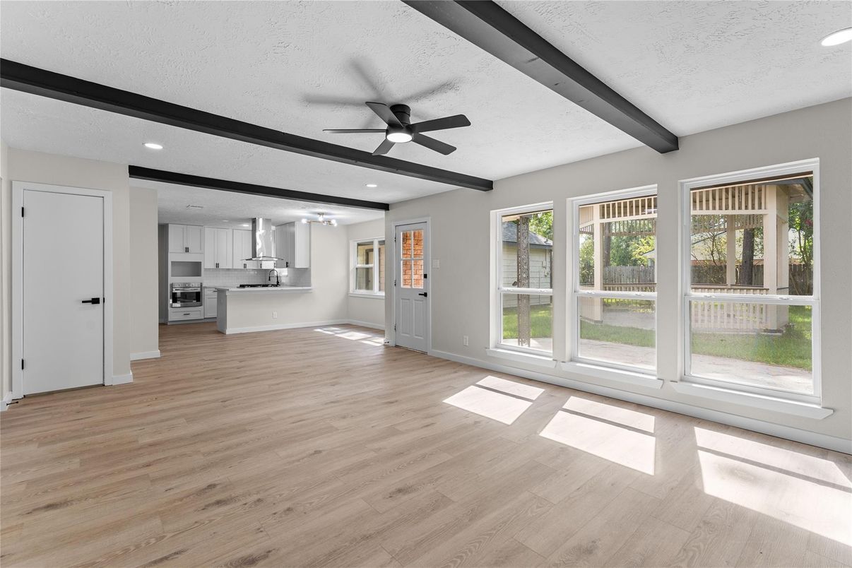 Empty room, Interior, Kitchen, Recessed Lighting, Stainless Steel Appliances, Wooden Beams, Wood Texture Flooring