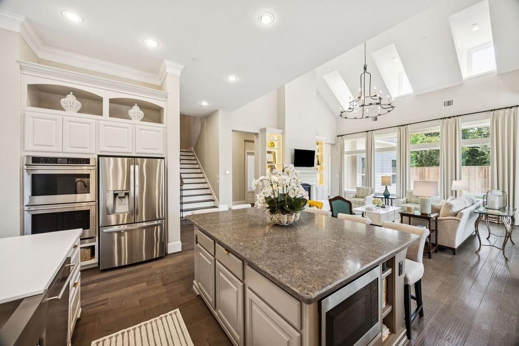 Chandelier, Dining room, Interior, Kitchen, Living room, Recessed Lighting, Stainless Steel Appliances, Wood Texture Flooring