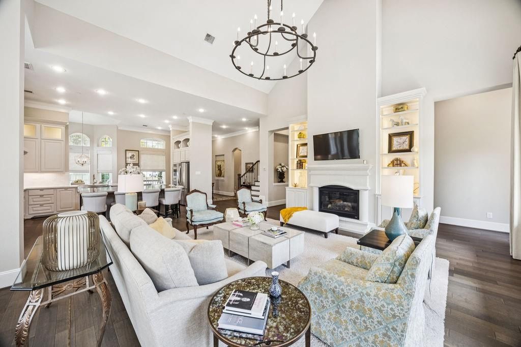 Chandelier, Dining room, Fireplace, Interior, Living room, Pendant Lights, Recessed Lighting, Wood Texture Flooring