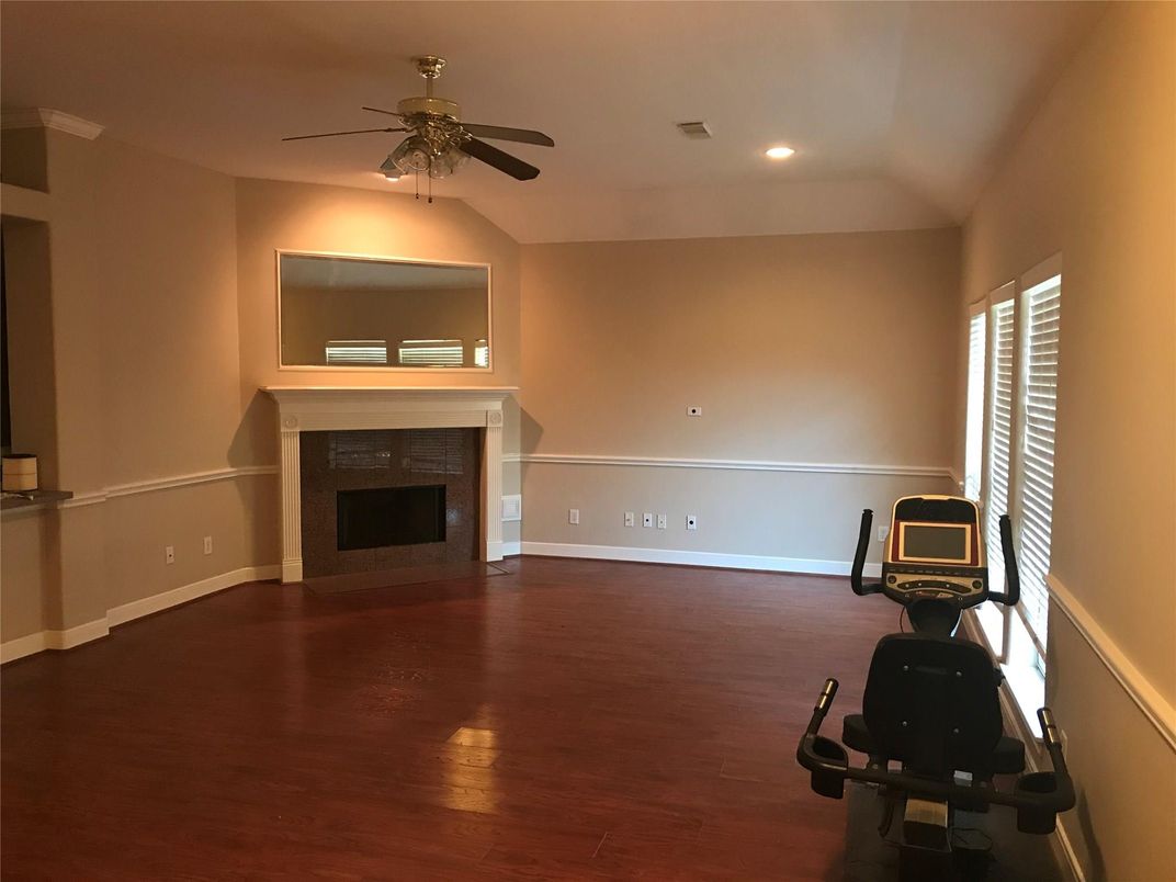 Fireplace, Fitness Equipment, Interior, Recessed Lighting, Wood Texture Flooring