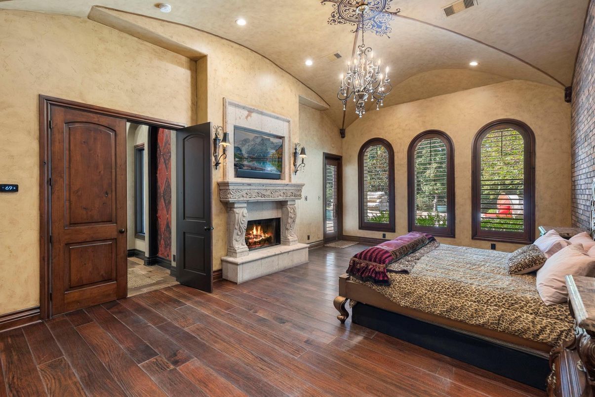 Bedroom, Chandelier, Fireplace, Interior, Recessed Lighting, Wood Texture Flooring