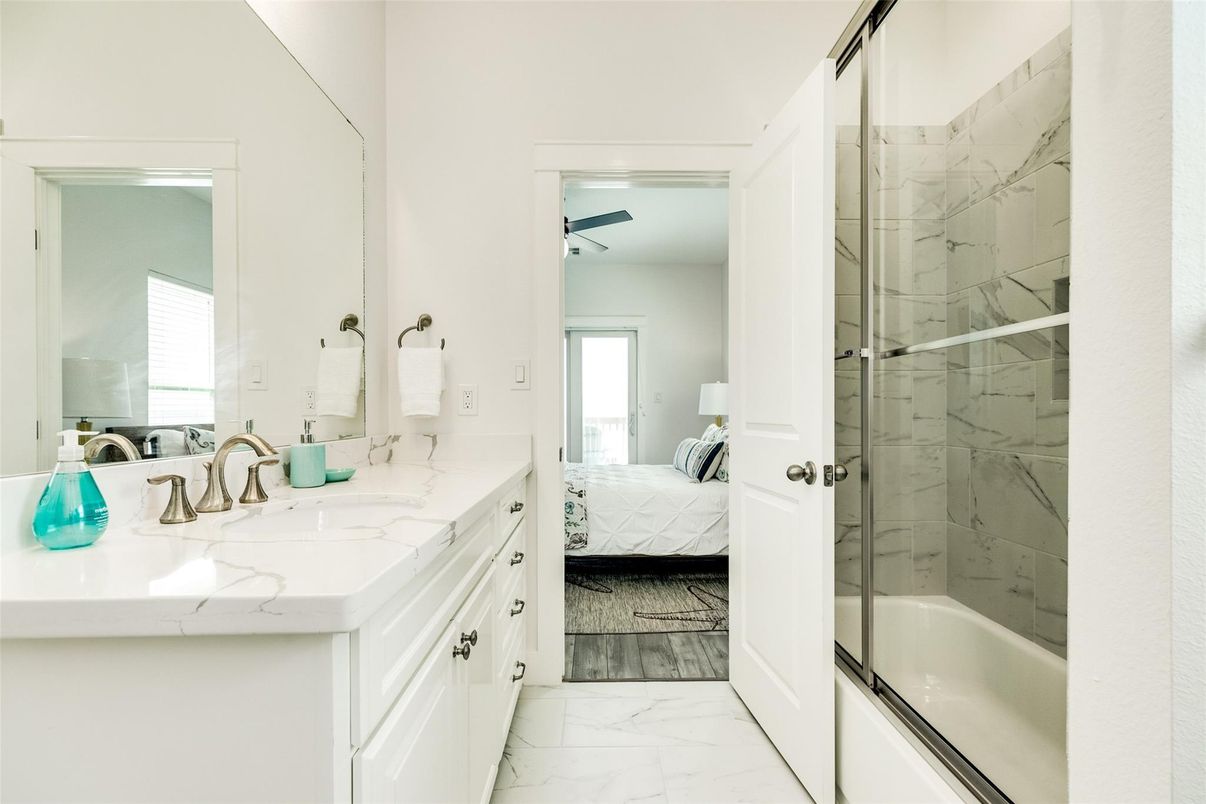 Bathroom, Bedroom, Dual Sink Vanities, Glass Shower, Interior, Marble, Marble Walls, Wood Texture Flooring